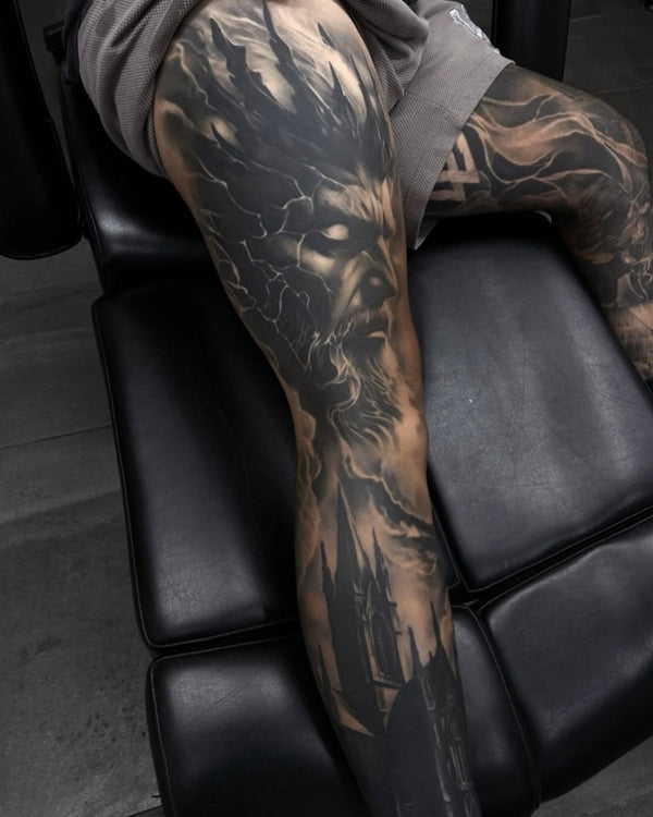 Black and grey realism portrait tattoo on leg